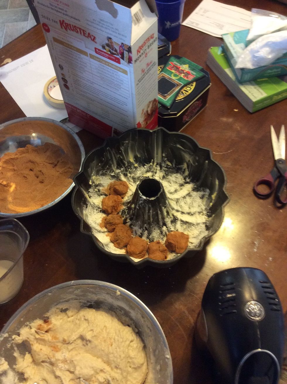 Now place it in the Bundt pan just go around in a circle. Do step 15-18 over and over until you have no more dough. Don't worry about the extra sugar it will be used.