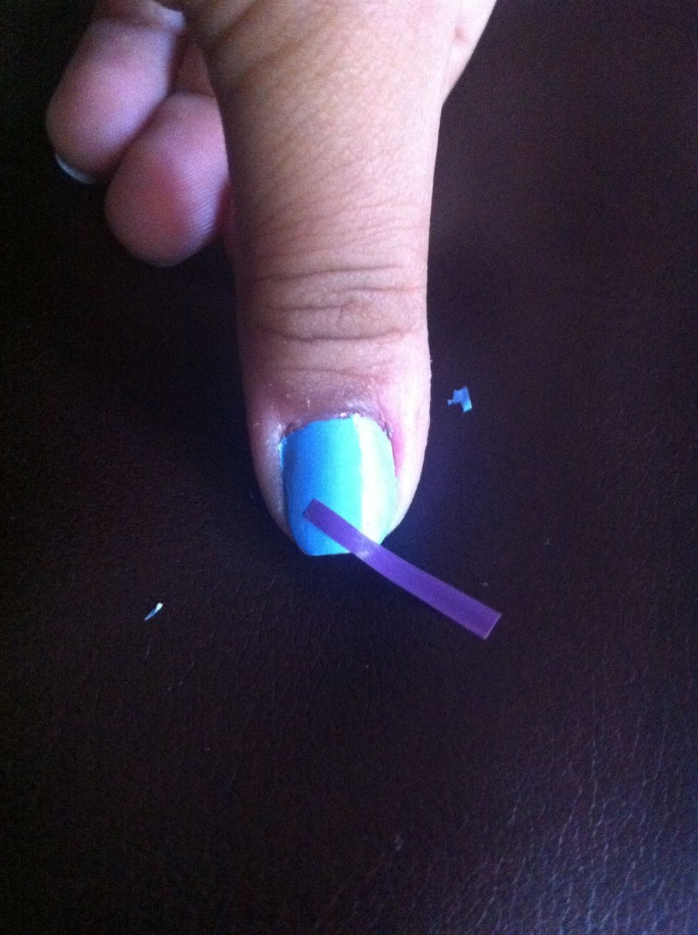Now place one diagonally across the tip of ypur nail at the middle to one corner. Like that^^^