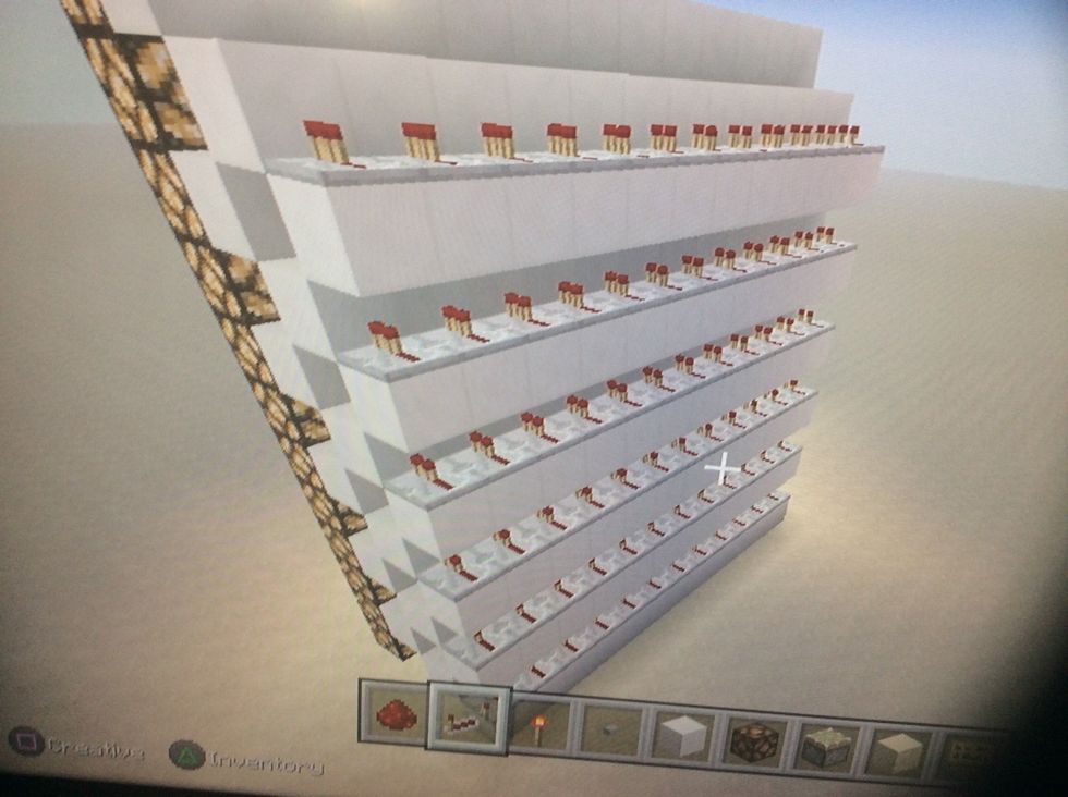 Now place redstone repeaters on the blocks like this.