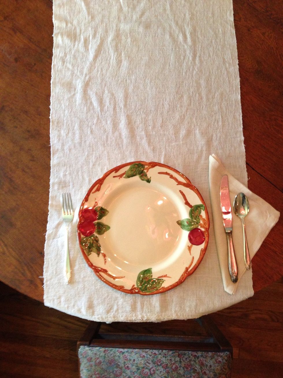 Now place the entr\u00e9e fork to the left of the dinner plate.