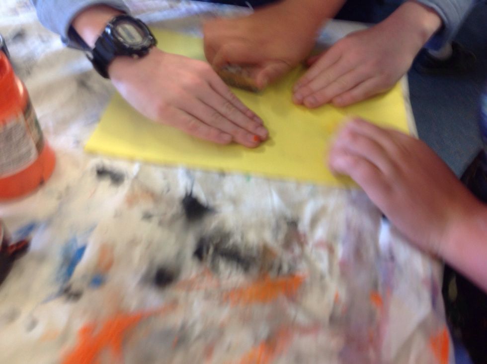 Now place the Lino on the piece of paper and turn the paper over and rub the paper so the ink sticks to the paper