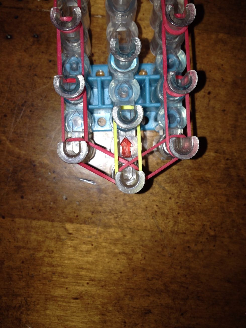 Now place your next rubber band going directly up