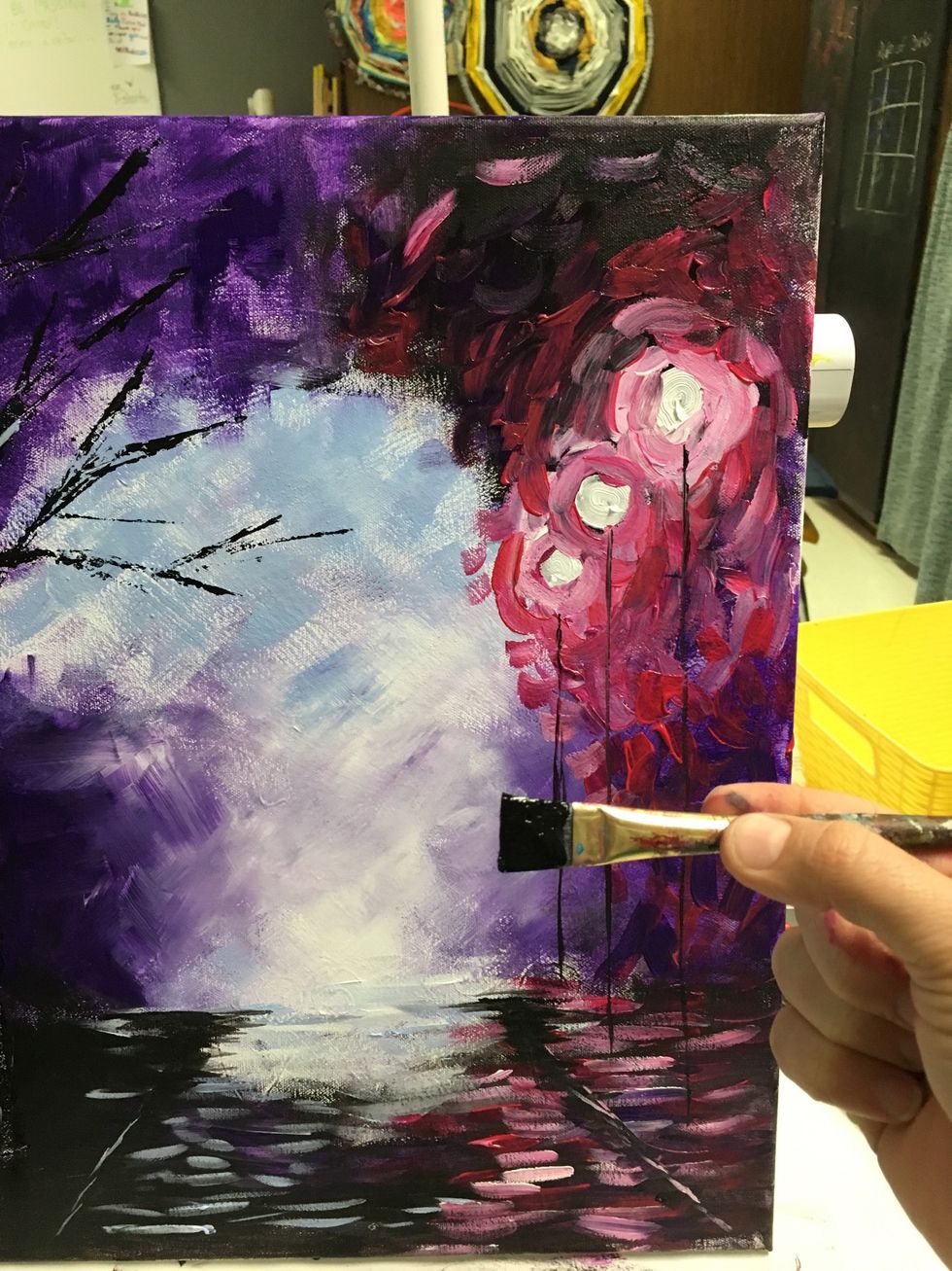 Now poles for the lights. Us a flat brush and draw a vertical line from each dot downward. Bring each of them about 1/2 inch from the edge of the street. They shouldn't be even or the same length.