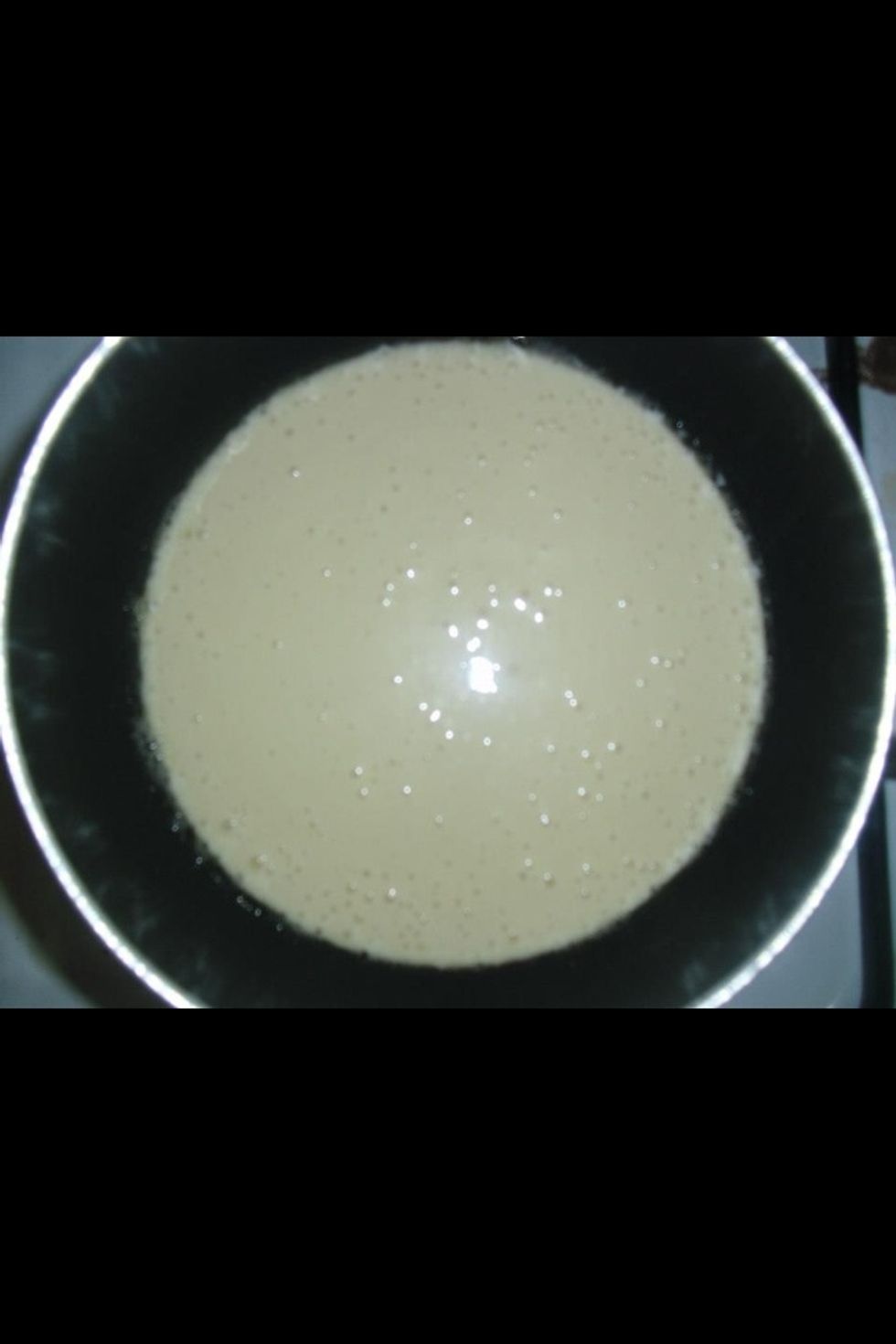 Now pour about a third of a cup of batter into the pan. This isn't exact. If you want larger pancakes, pour more. For smaller pancakes, pour less batter.