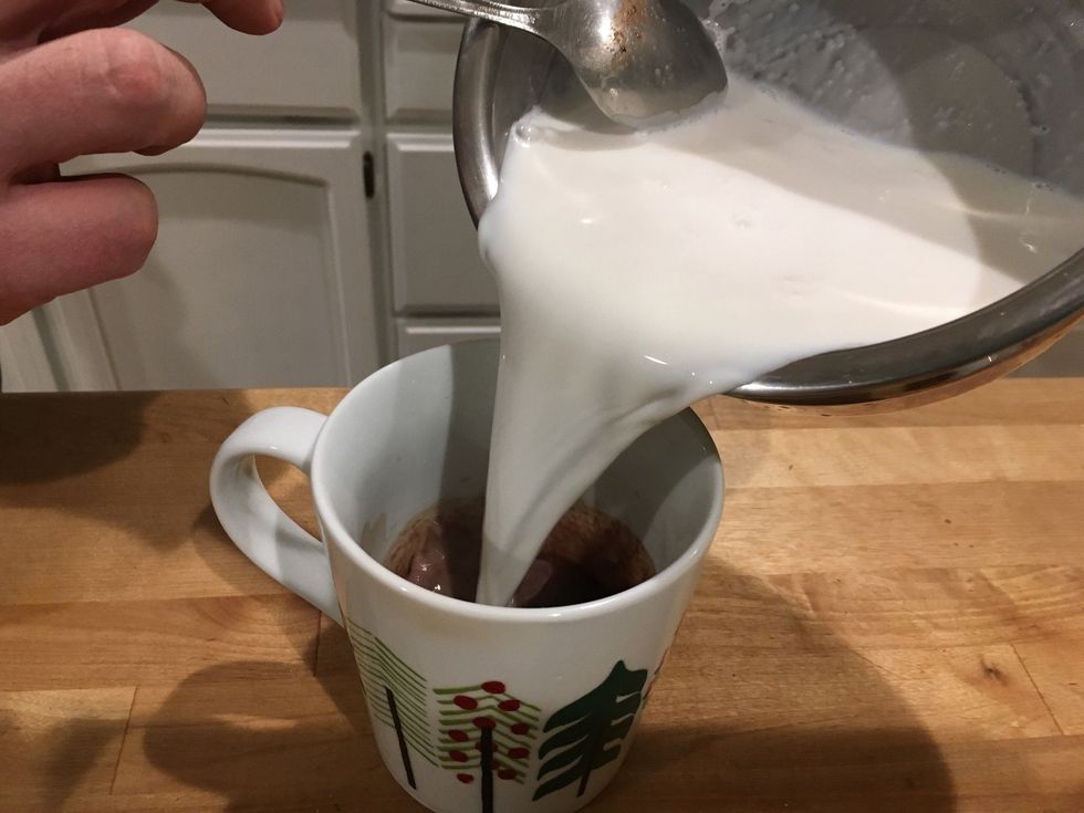Now pour half of the milk in