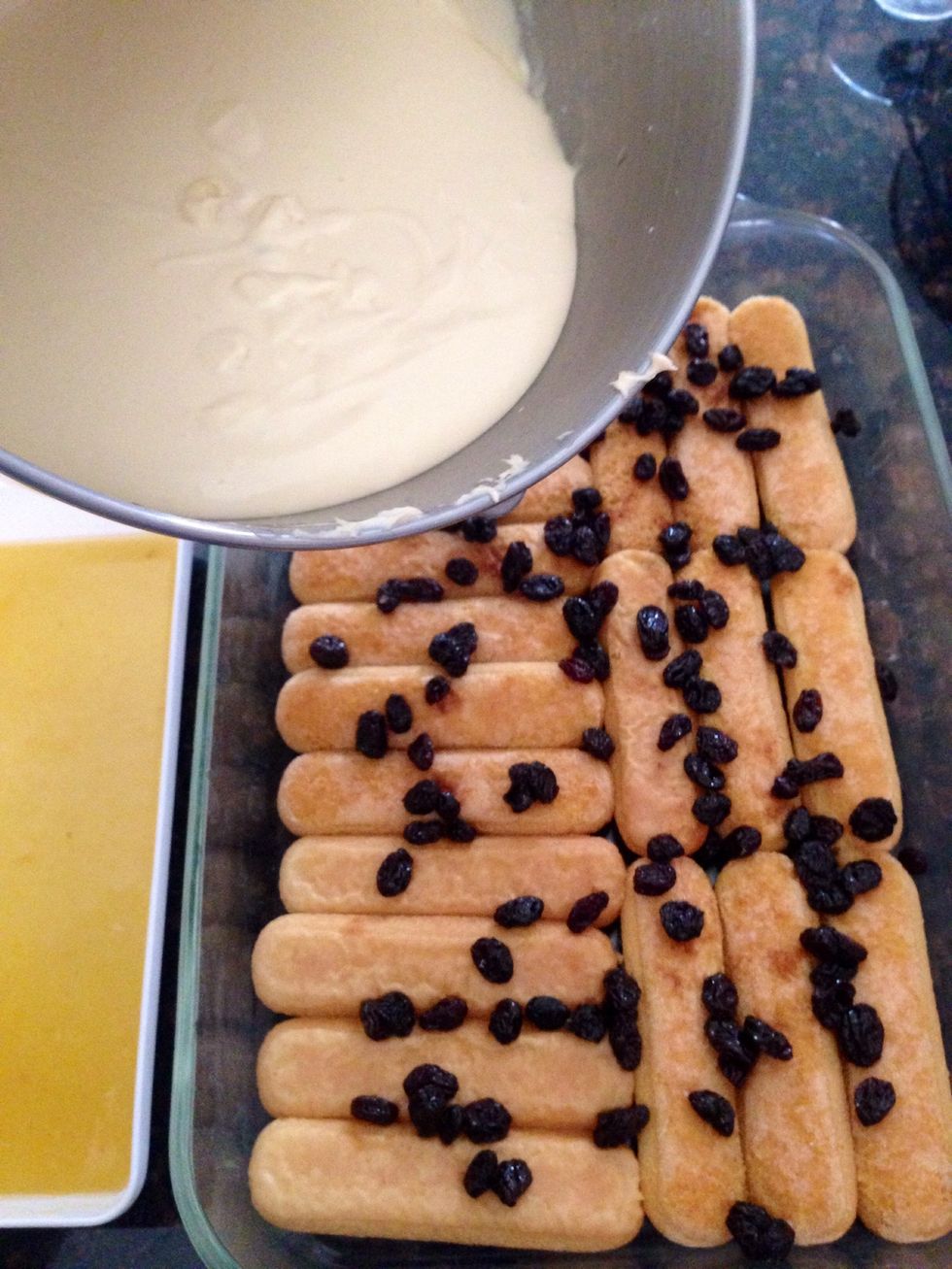 Now pour half the Tiramisu Batter on top of lady fingers.