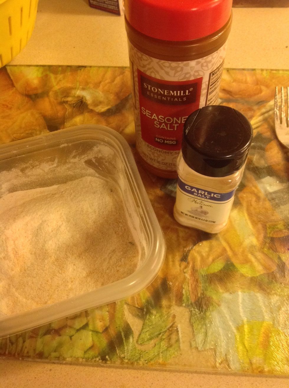 Now pour in the small bowl 1-2 cups of wonder or floor into it. (Depending on size of bowl) take seasoned salt and garlic salt (or other season) and sprinkle it lightly into the wonder.