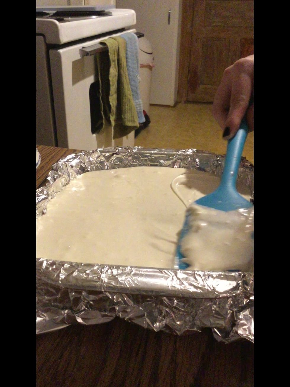 Now pour the marshmallow mix over the chocolate and spread it out evenly, then put it in the fridge to cool over night