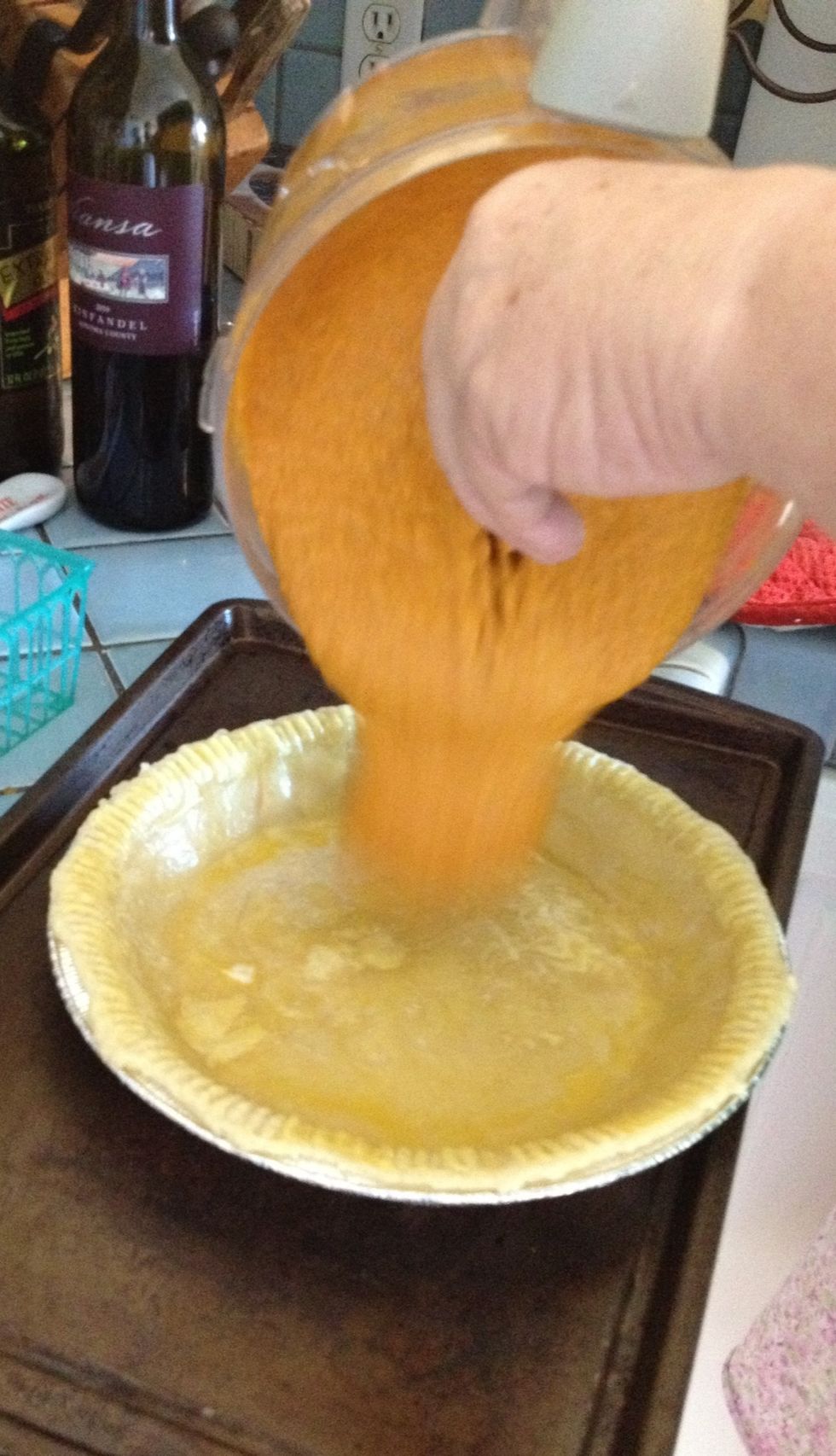 Now pour the pumpkin mixture into each of your pie crusts.