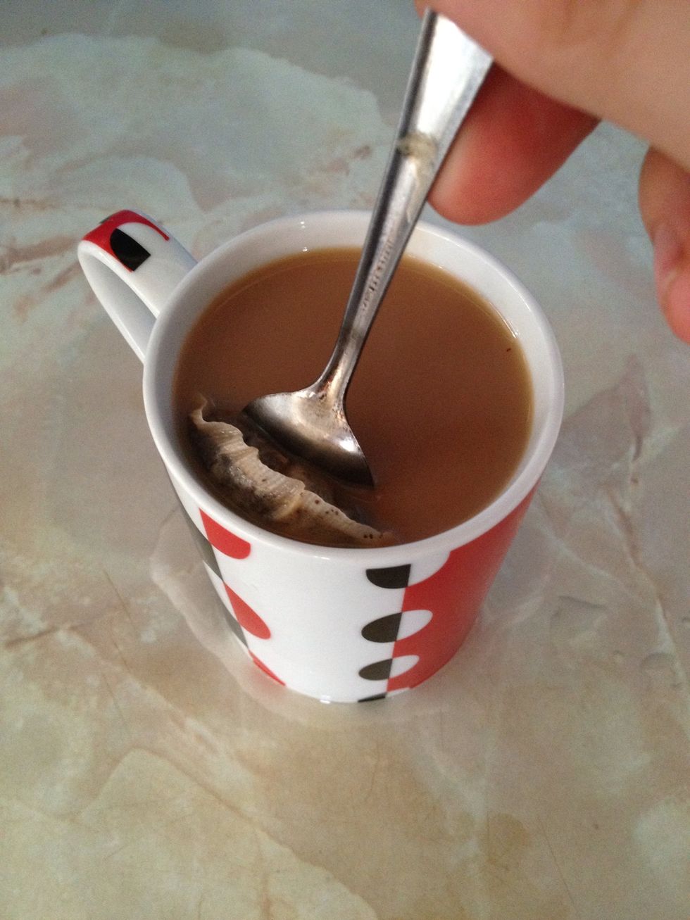 Now press the tea bagh against the side of your cup/mug several times to extract extra flavour. Or if you prefer a weaker tea just take the bag out and let it drip into cup.