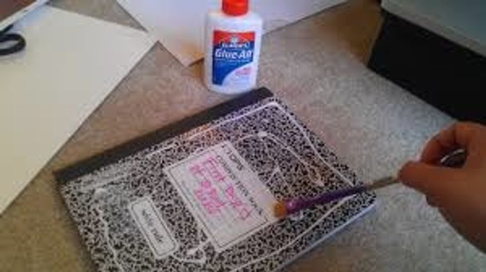 now print out the pic either on glossy picture paper or regular paper. Then spread either modpodge or glue on your notebook with a index card or paint brush