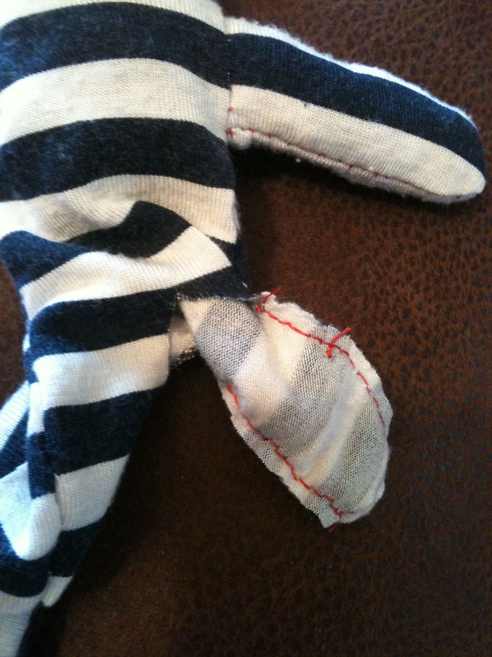 Now pull a leg out to the side and flip it around like this so you can sew along the inside leg, don't sew all the way to the top, you need a gap in its 'crotch' to stuff the rest of the bear.