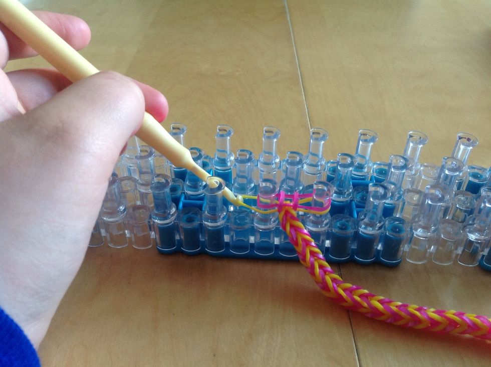 Now pull back the bottom band and loop it up. ( don't put a band on top)