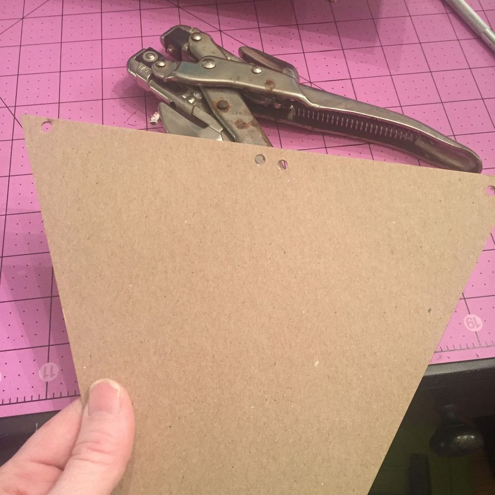 Now punch some hole- this pic got cropped weird but I have a hole in each top corner, then two in the center- don't get too picky about evens as the tulle will hide any small differences