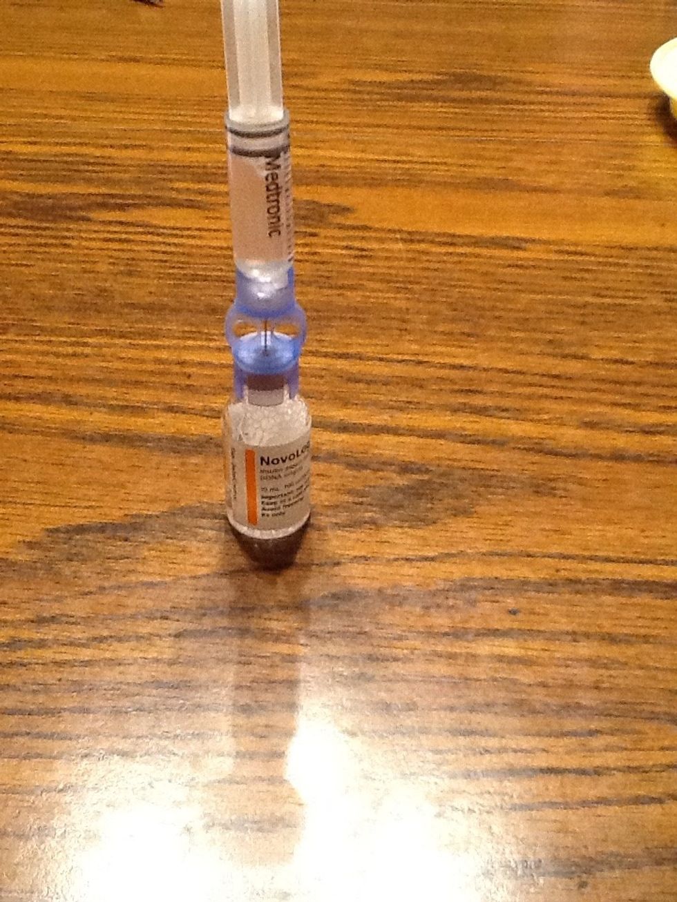 Now push all the air into the bottle and slowly pull back the syringe until the reservoir is completely full then you gently hit the reservoir until all air bubbles are out