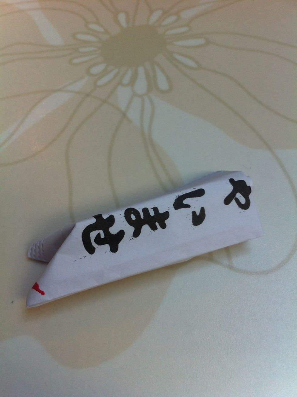 Now push the edge of the wrapper into itself like so.