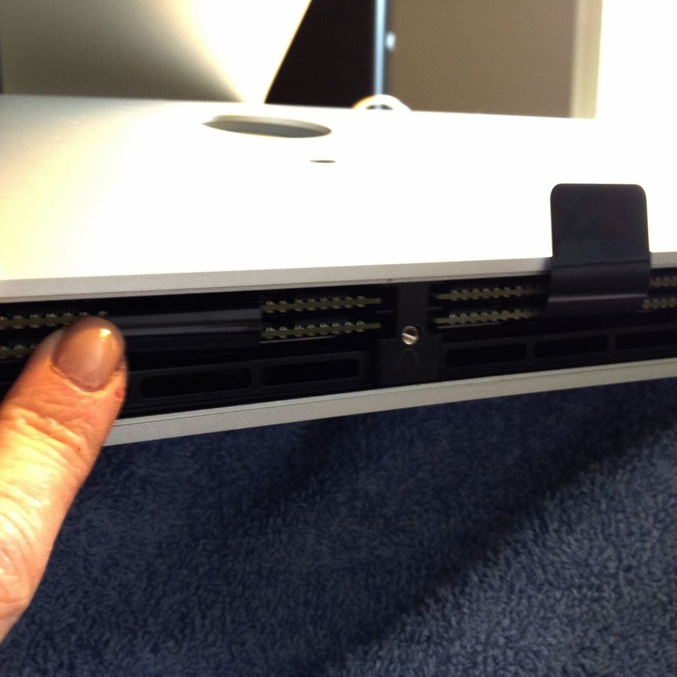 Now push the new RAM securely into place in one of the four channels. Don't be soft - give it a good push then replace the plastic tabs