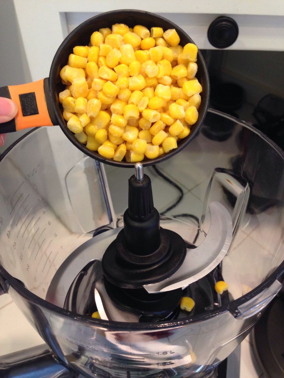 Now put 2 cups of the frozen corn in a food processor or blender and blend!
