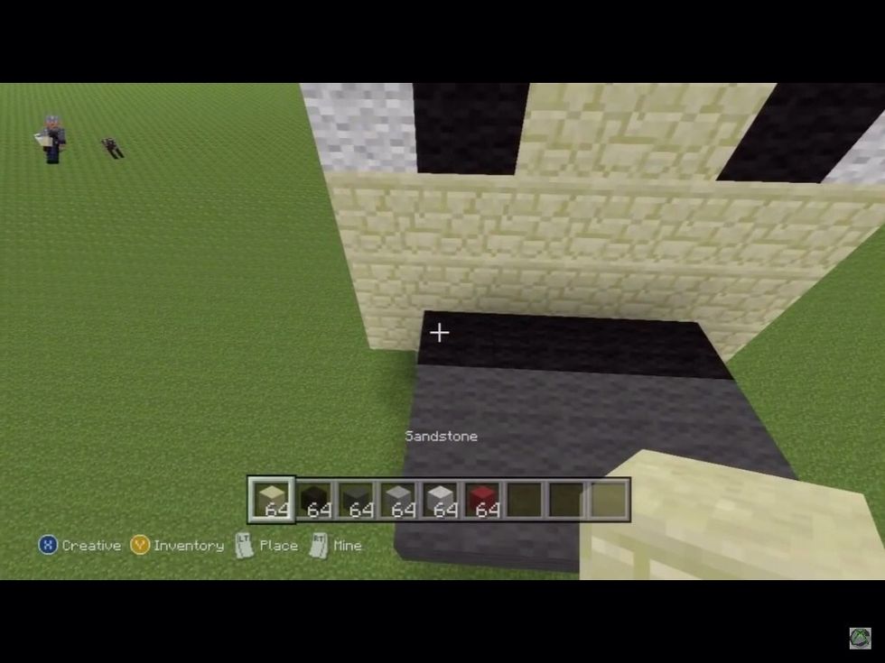 Now put 3 blocks of black wool and 6 blocks of dark grey wool to make the bottom of the wolf's noise