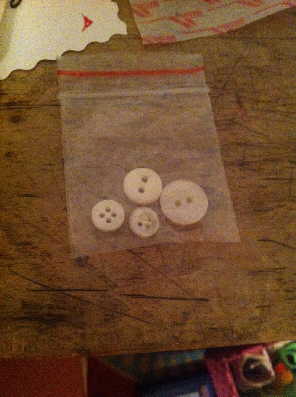 Now put a few buttons into a small bag, roll it up, and stick in right below the measuring tape