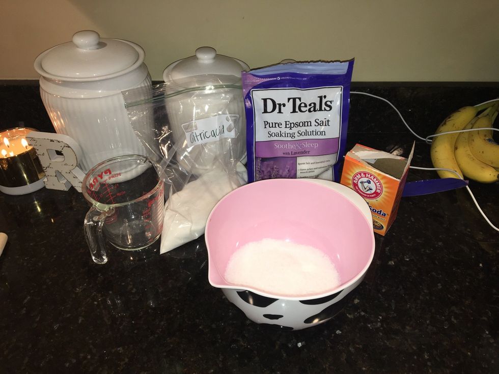 Now put all the dry ingredients in the bowl; 1 cup of baking soda, 1/2 cup of Epsom salts, and 1/2 of citric acid.