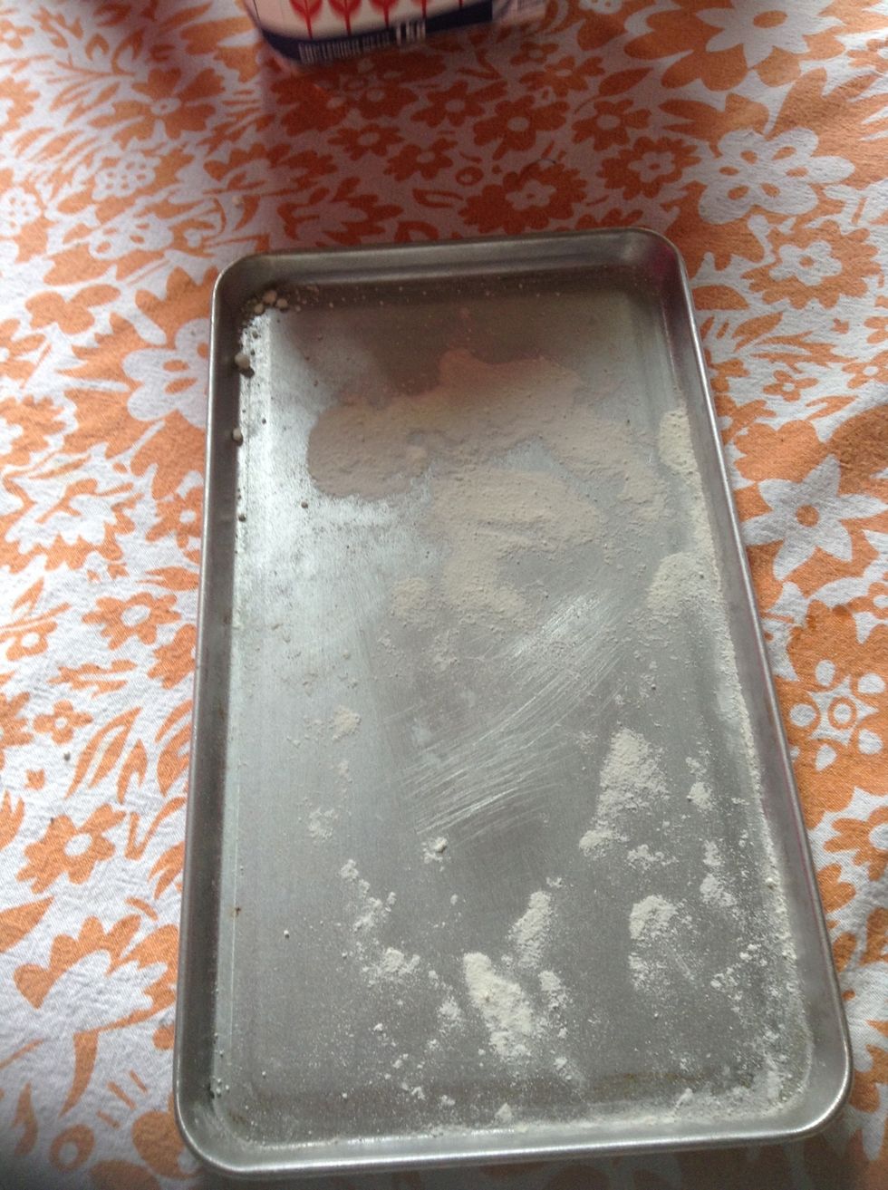 Now put flour at the pan