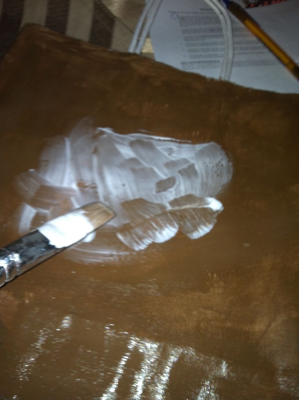 Now put glue where you want to put your pretty scrapbook paper. Im choosing to cut up a bunch of different paper and creating a big rectangle