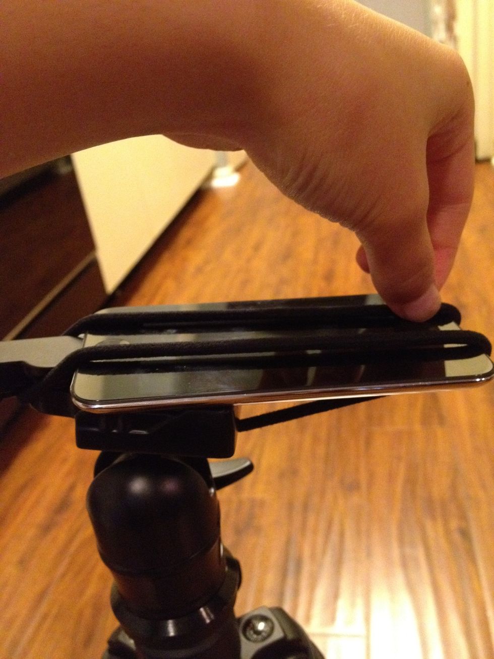 Now put it around your device's other side. Make sure that the tension on both sides are equal.