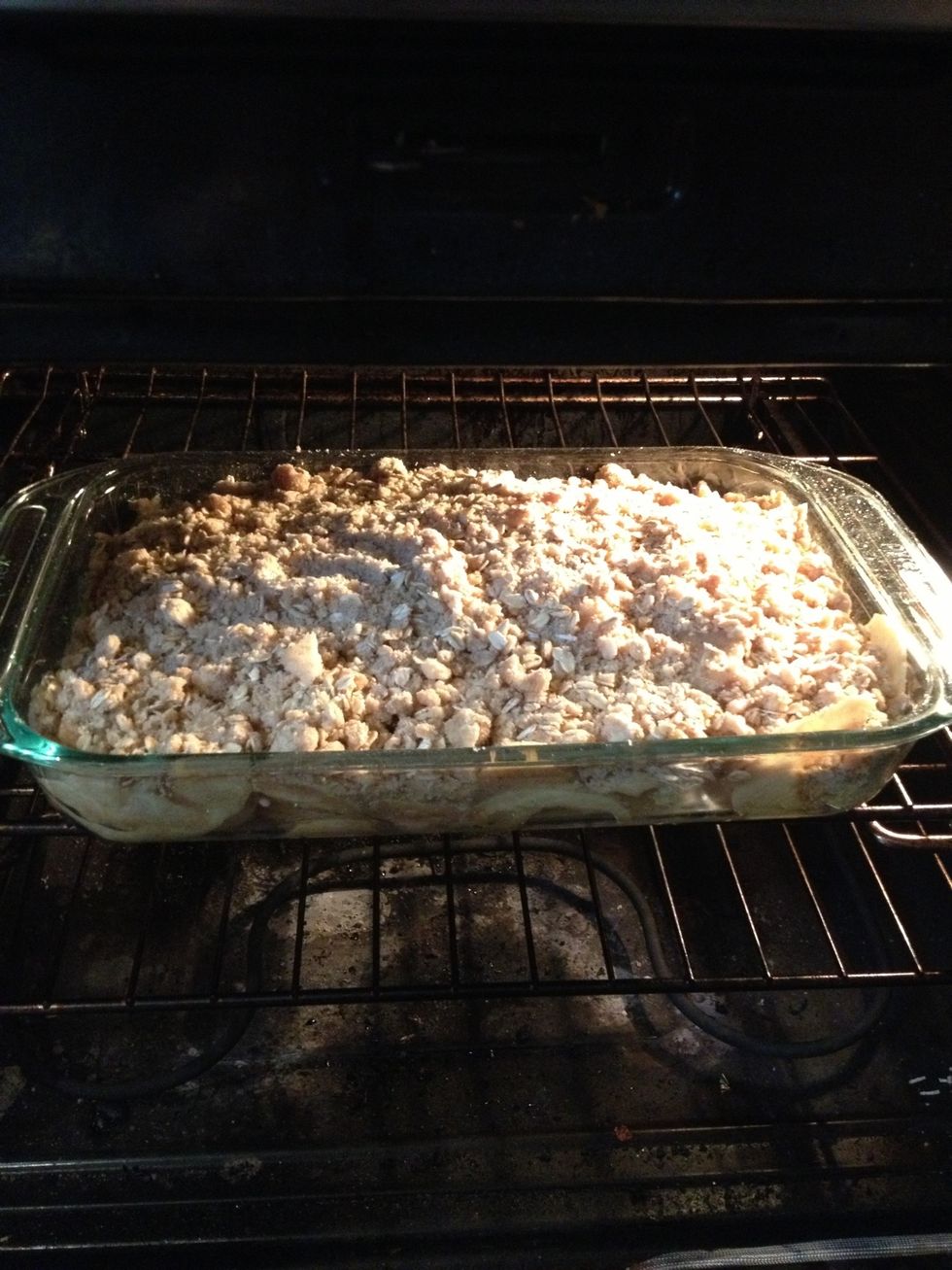 Now put it in the preheated 350 oven for 45 minutes. After the 45 minutes go by, test the middle for both apple softness and how hot it is.  Mine took about an hour to be ready\u263a