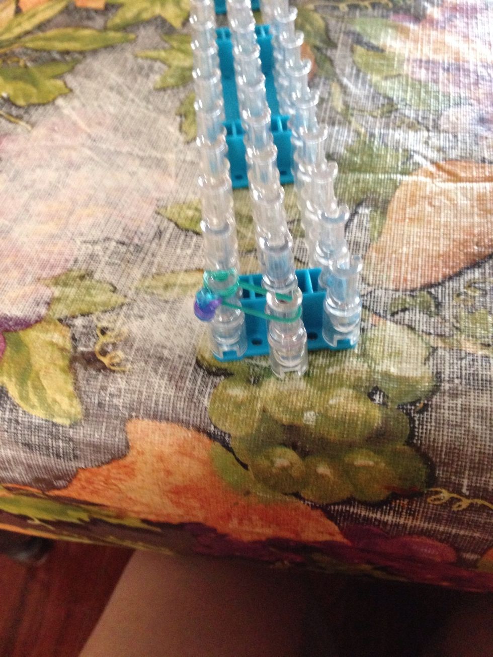 Now put one green rubber band on (not doubled) and put on one of the rose buds