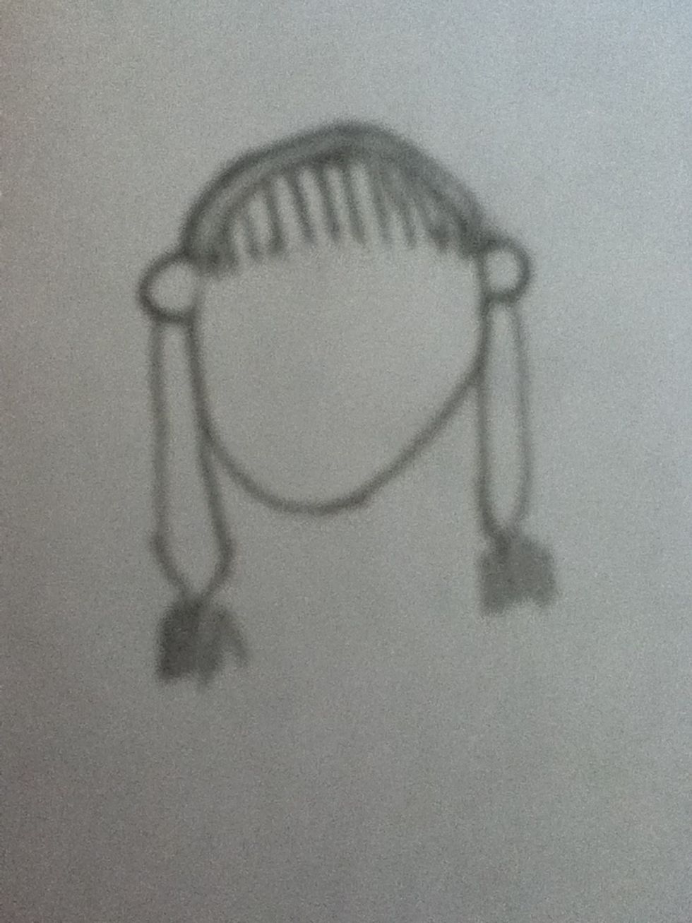 Now put some hair under the ears by drawing an oval on both sides then taking your pencil and softly drawing small lines under the oval