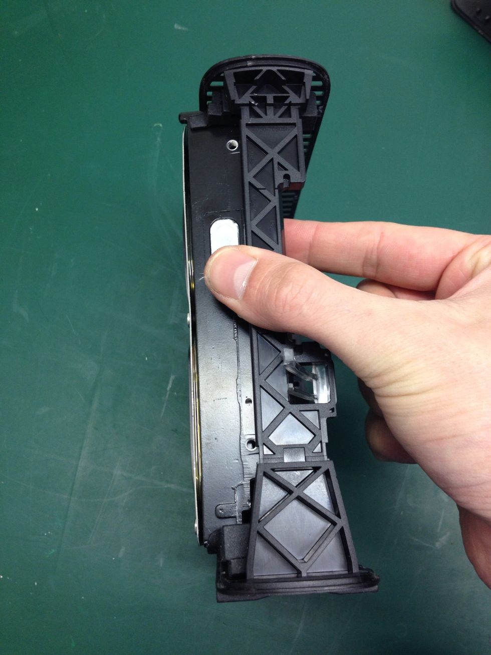 Now put the chassis up on its left edge and carefully push the drive out of the chassis from it underside, but not all the way!