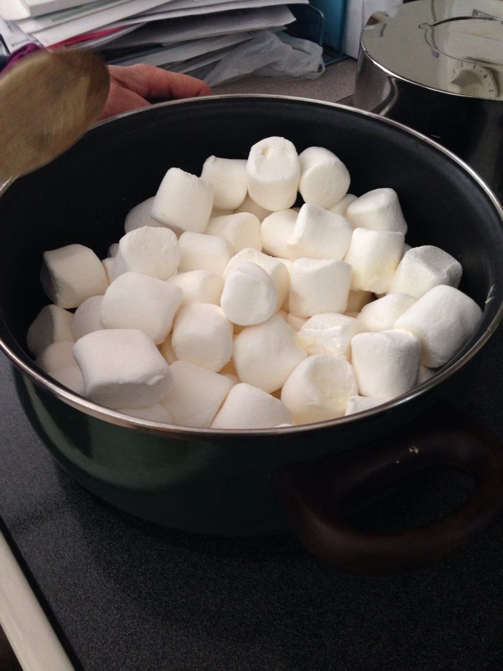 Now put the marshmallows 2 10 ounce bags or 1 10 ounce bag in with the butter and wait unitil they are all melted... Stir the whole time ...