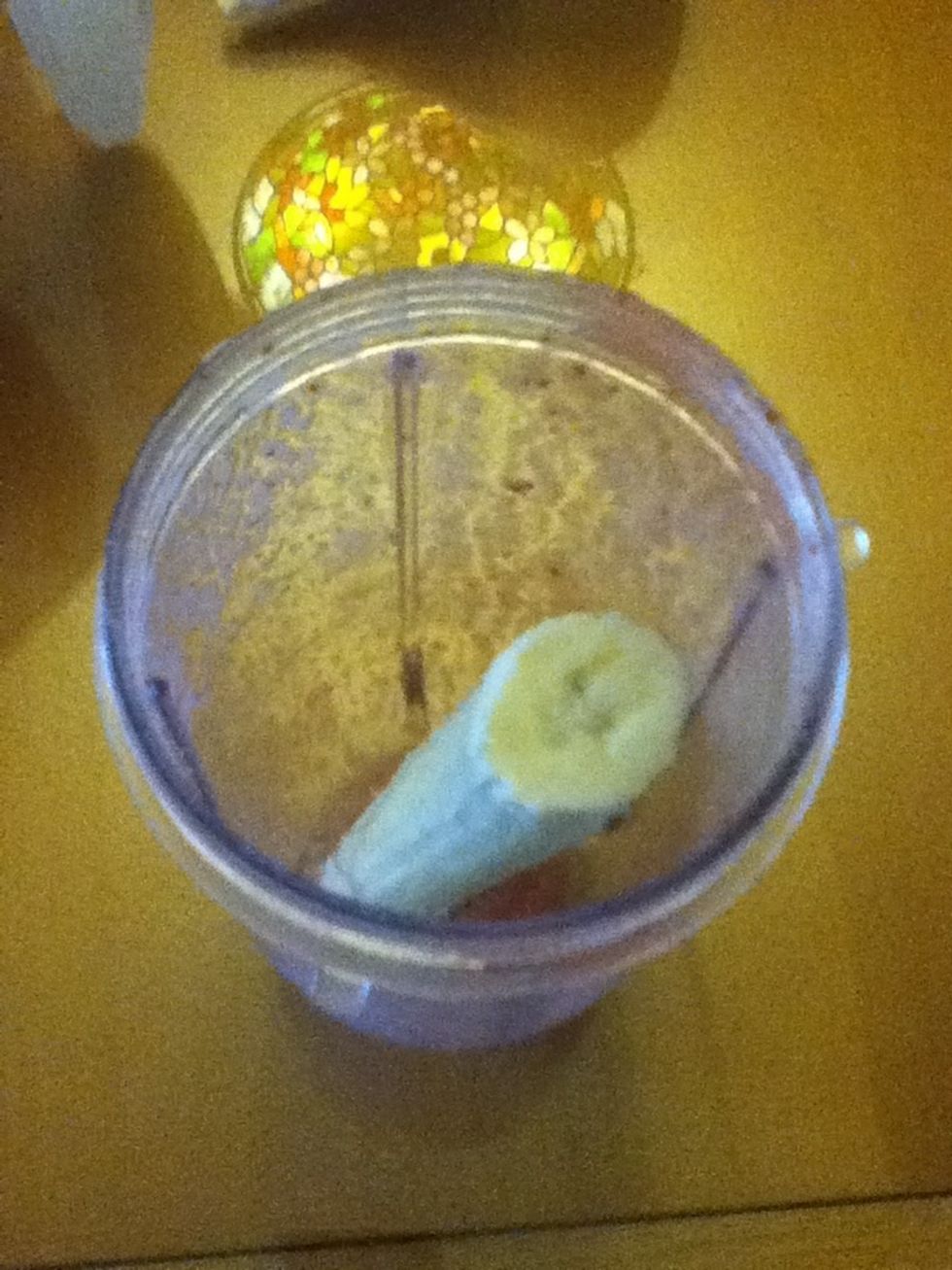 Now, put the other half of the banana in the blender.