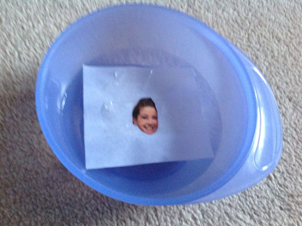 Now put the picture in warm water. Let it soak for about two minutes