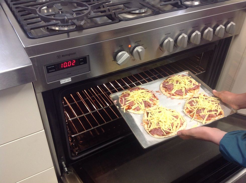 Now put the pizzas in the oven. 180 degrees take out once cheese is melted. About 20 mins
