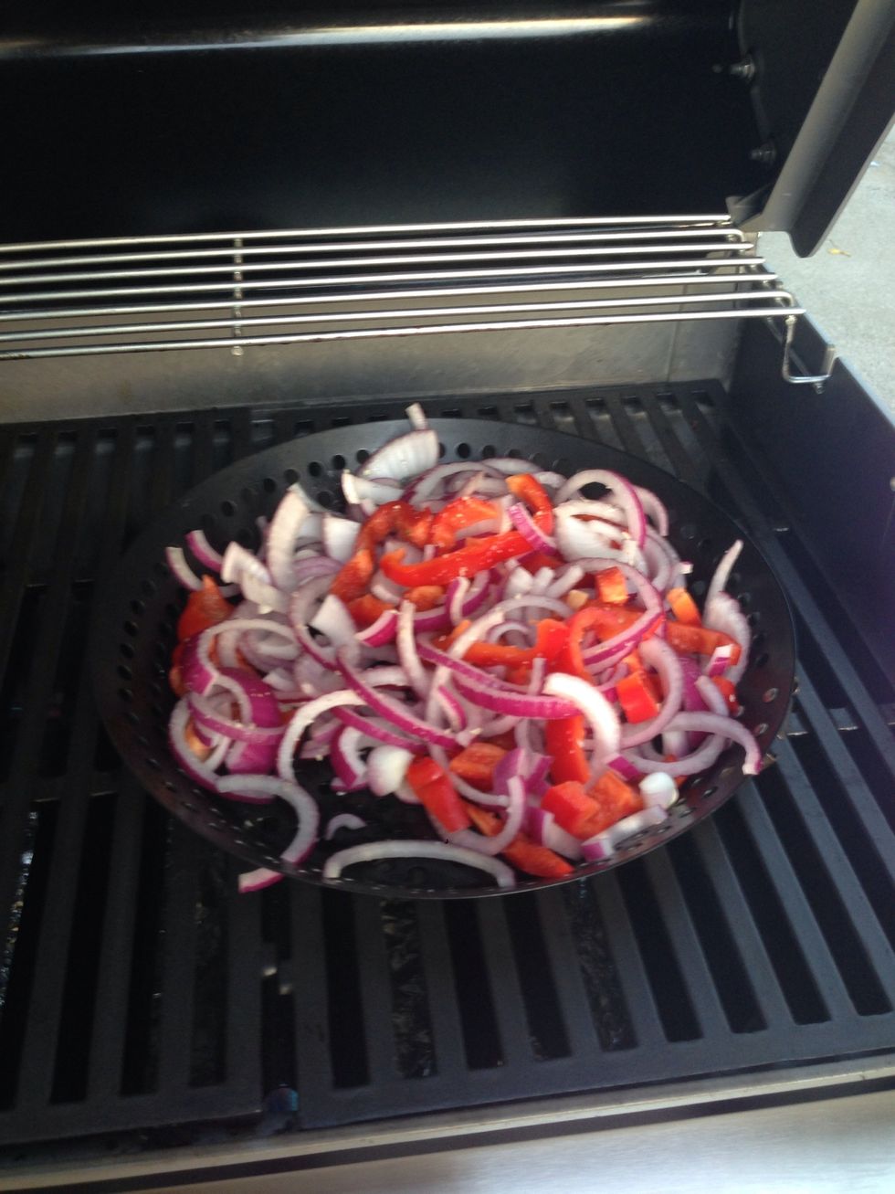 Now put the pot on the grill. Turn the heat to medium.