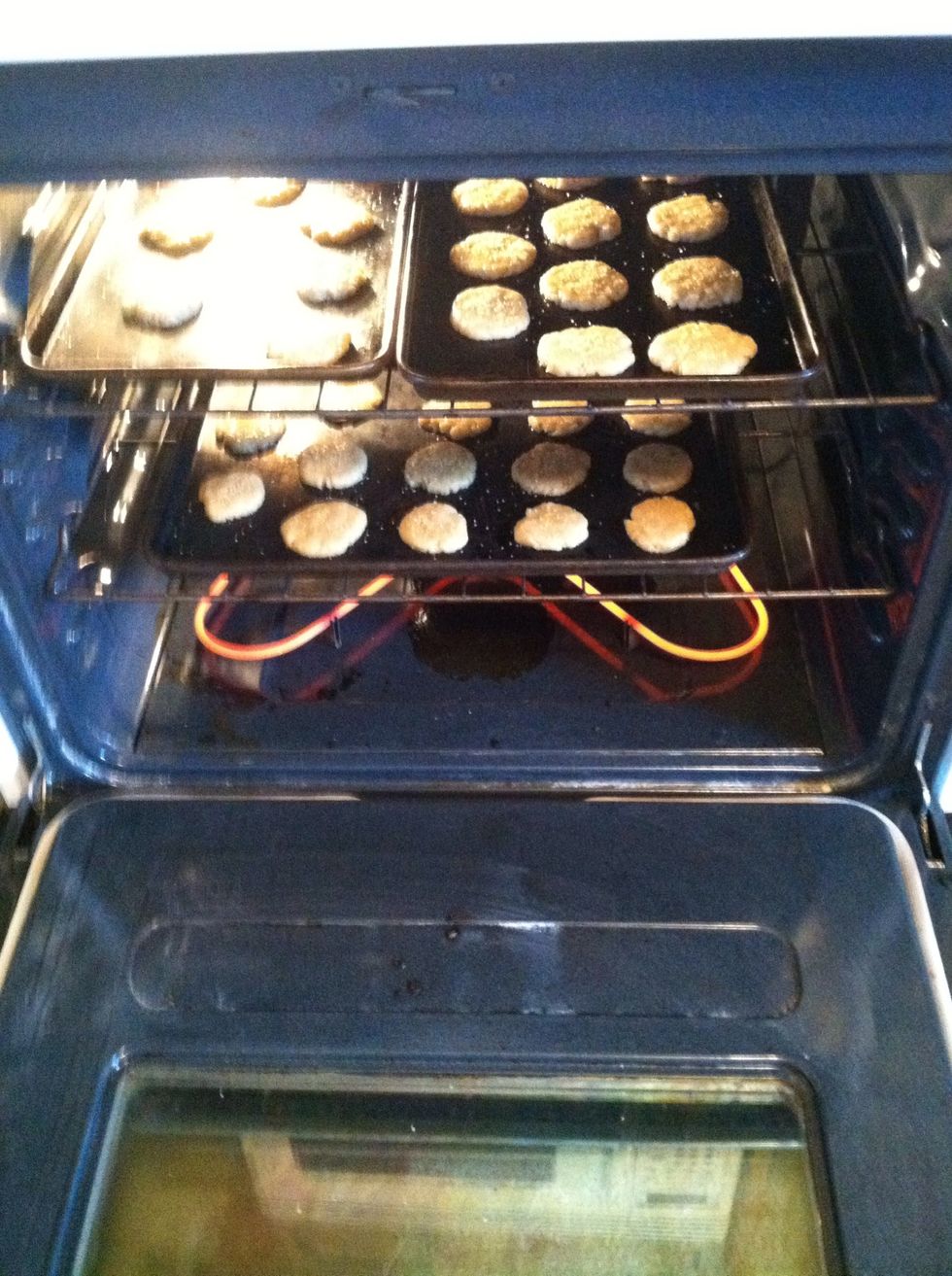 Now put those suckers in the oven for 6-7 minutes! You want them out before they start browning in the edges. They won't look done, but don't worry, they will still bake on the hot cookie sheets.