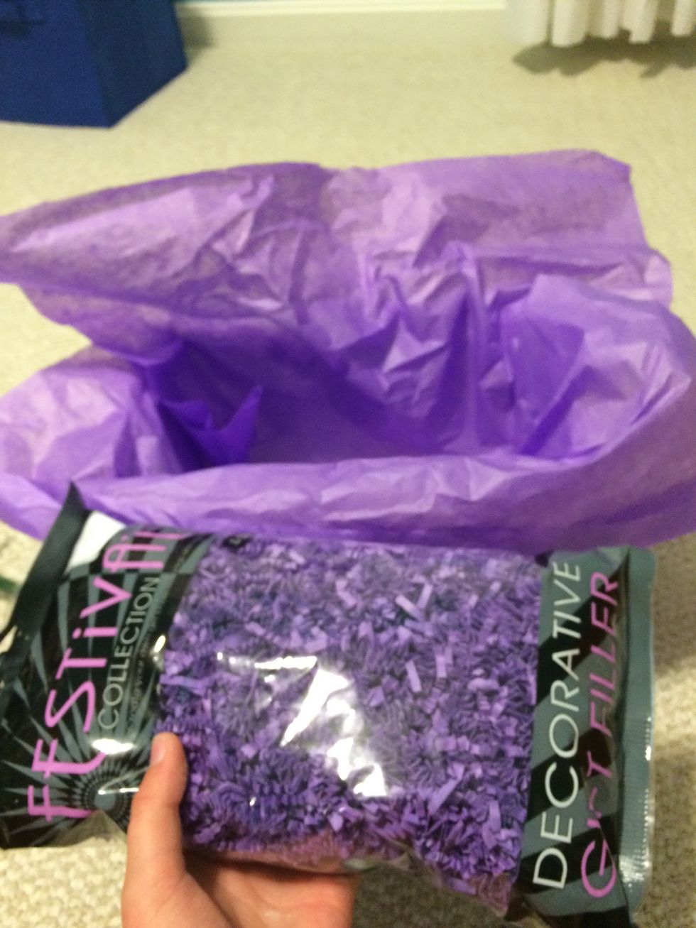 Now put tissue paper on the bottom of the basket and fill it with gift fill if you would like I did