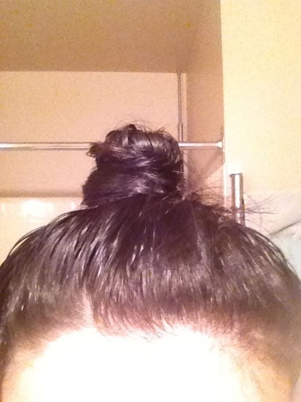 Now put your hair into a bun right at the top of your head an pin in place, let this sit for about 20 minutes or until hair is about 90% dry..this helps give a boost of volume to the roots.