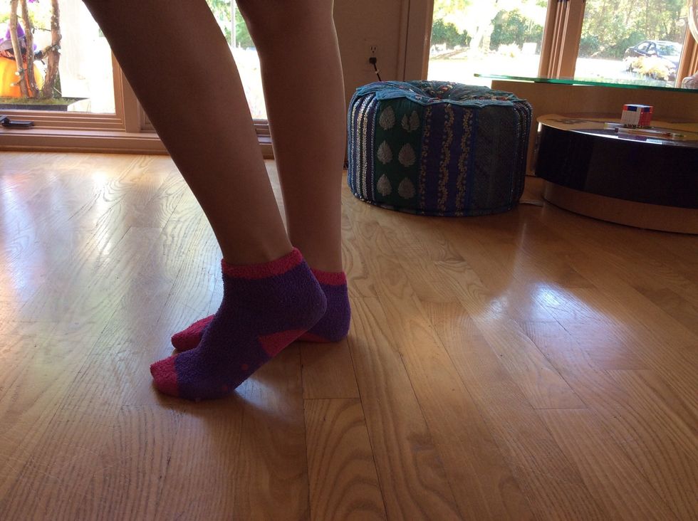 Now put your other foot flat on the floor, next to the foot with the heel in the air.