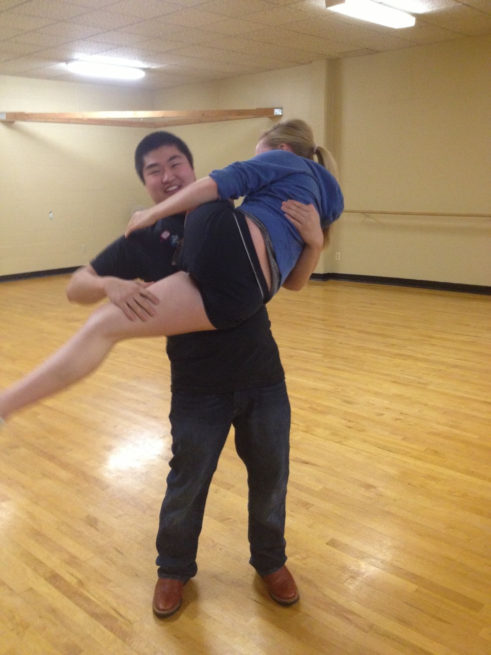 Now put your right hand on her thigh and push it downwards to help give her momentum to get her leg around you.