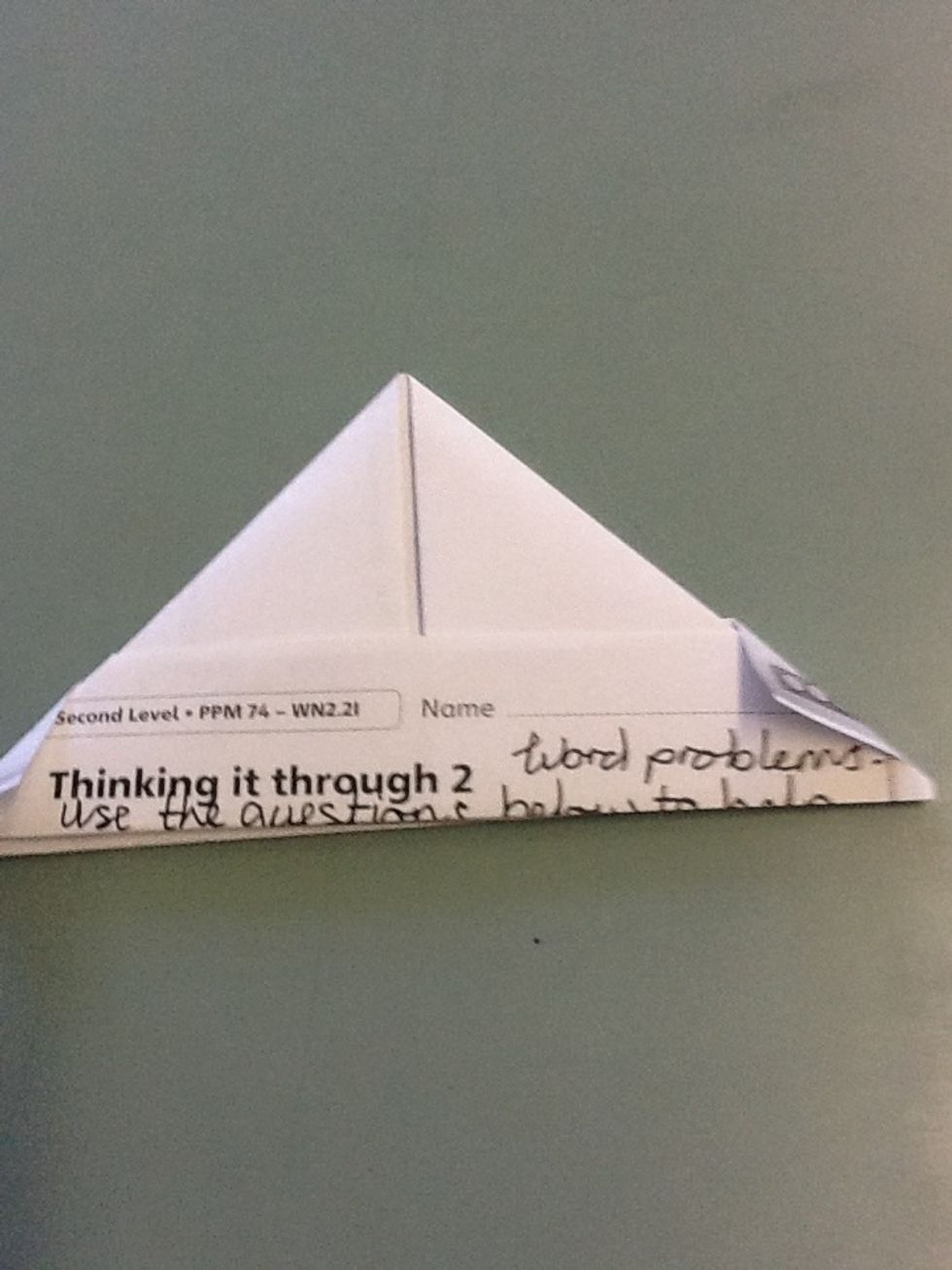 Now repeat action on the other side of the page, you should end up with a paper cone shape A.k.a a paper hat!