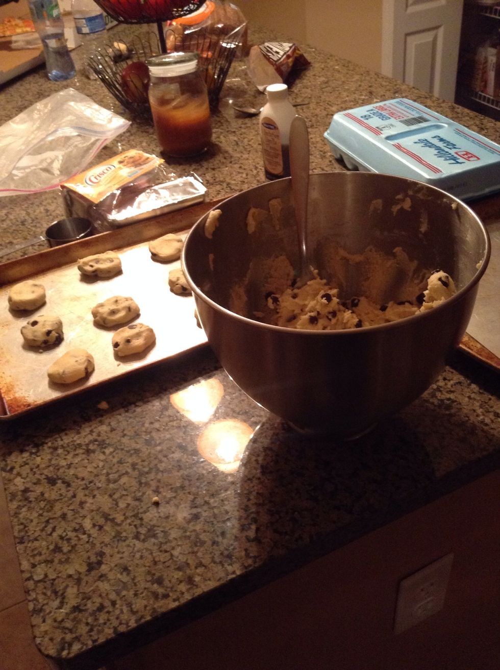 Now roll dough into balls and put them on pans