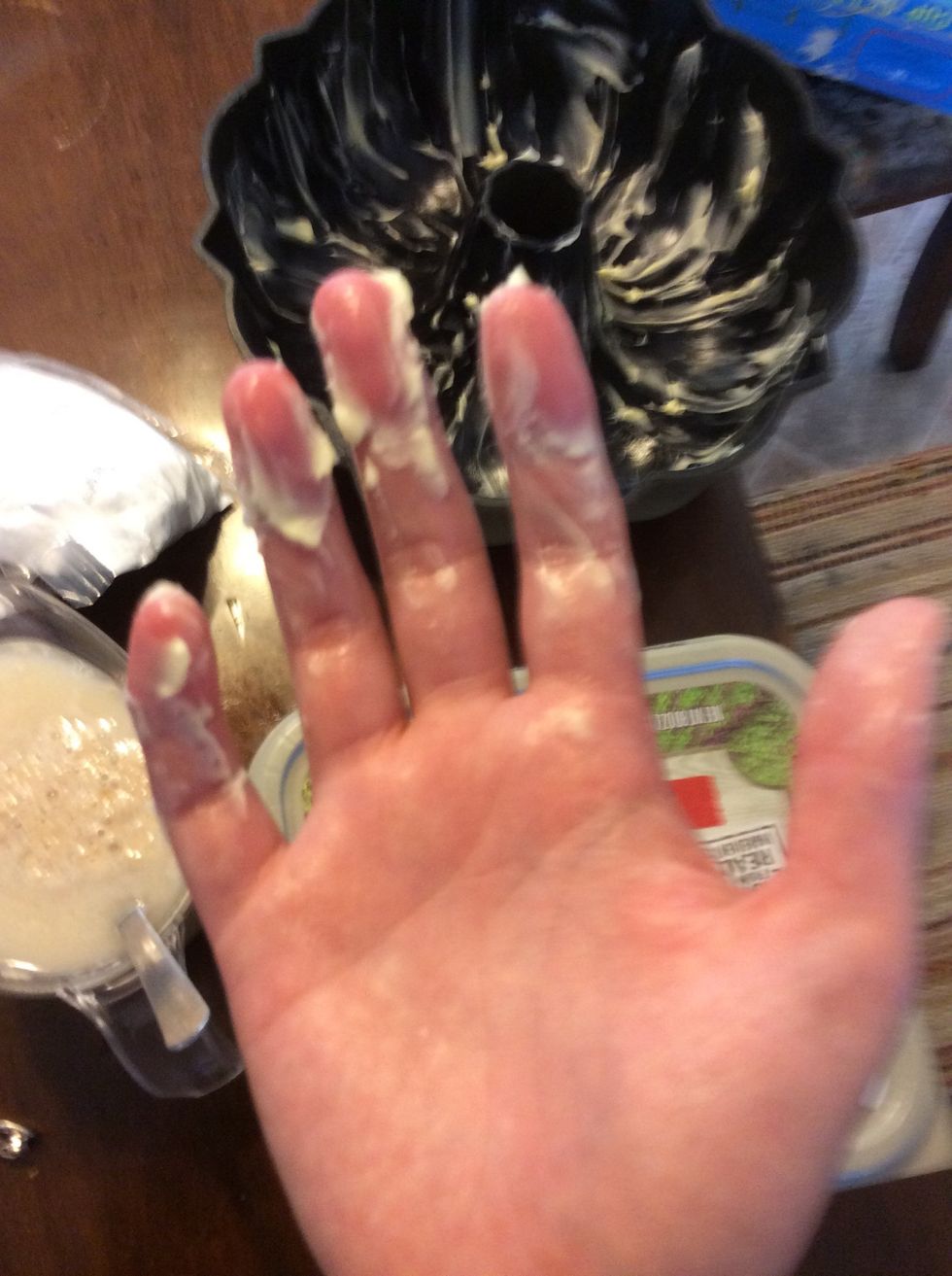 Now rub it all over the pan so your bread doesn't stick. My baking spray didn't work so my dad told me I could use this and a little bit of flour.