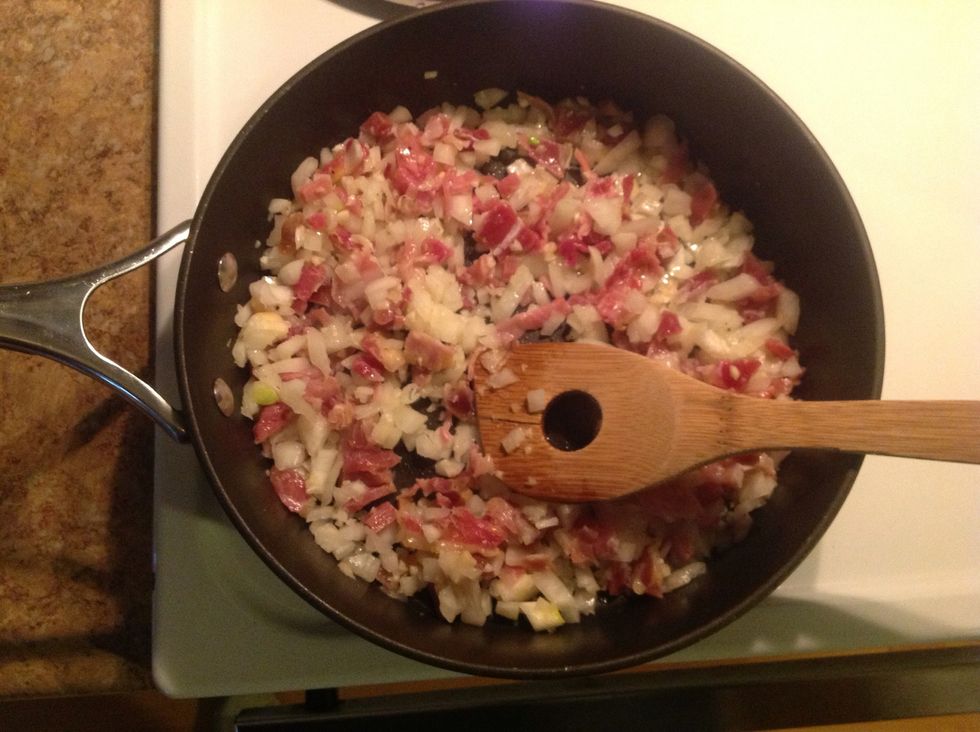 Now saut\u00e9 your mixture of garlic, onion and chopped pork for about 10 minutes or until onion is looking translucent.