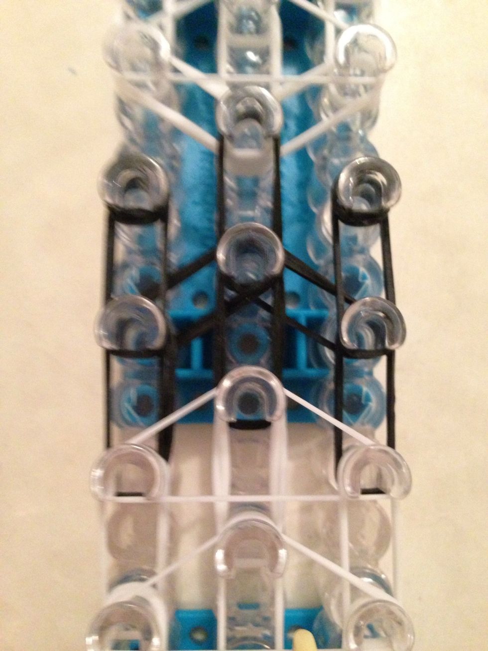 Now scoot your loom down to the arms of the panda you will hook the same way we did on the ears