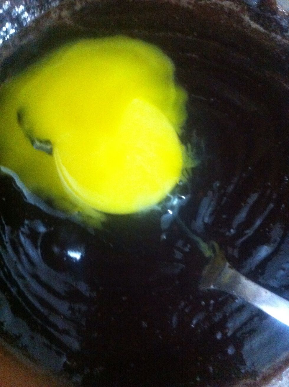 Now separate eggs carefully. Keep egg whites in separate bowl. And add egg yolks to the tempered chocolate one by one incorporating it quickly so the egg yolks don't scramble in the chocolate