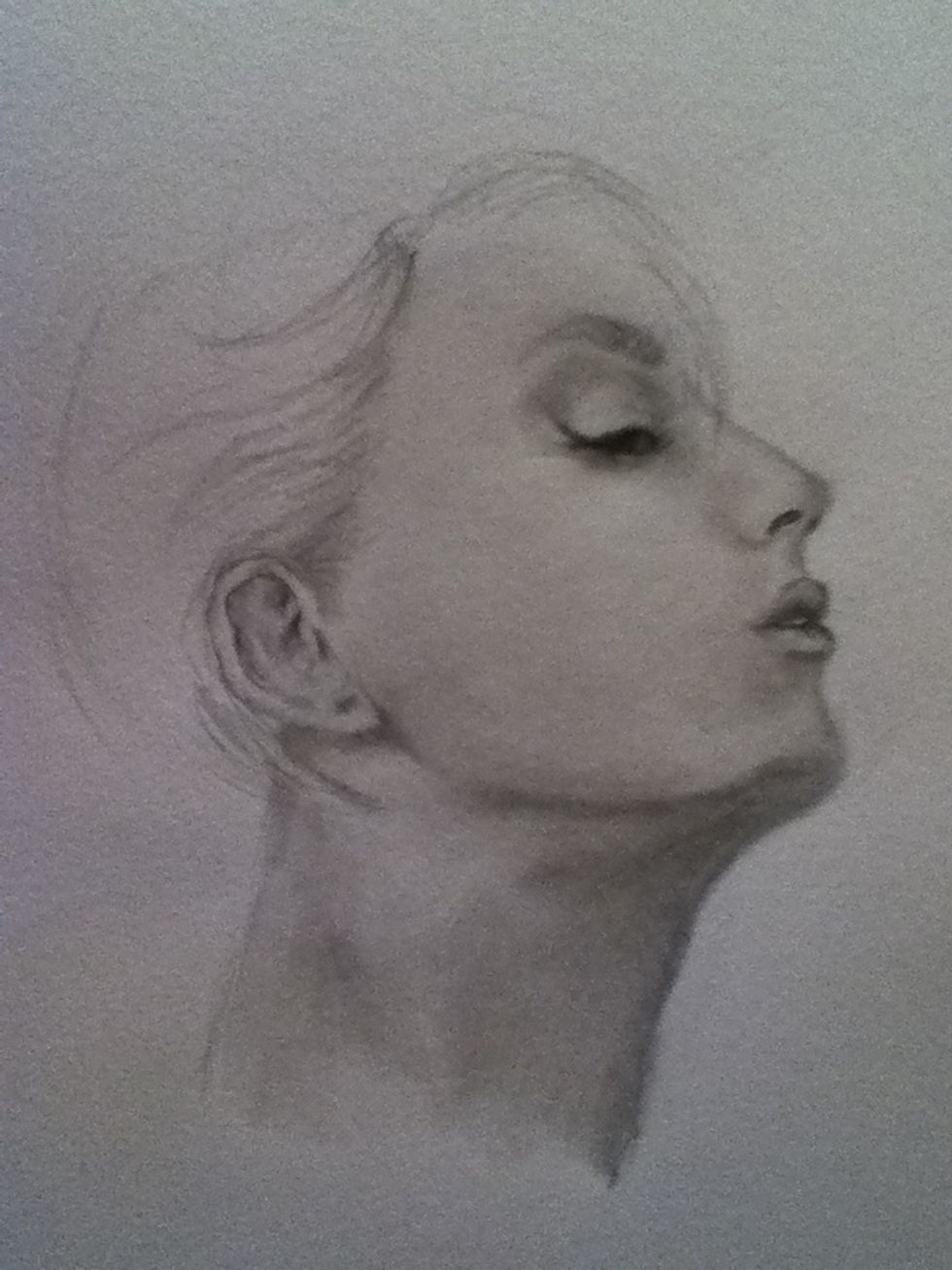 Now shade her skin, look at the muscles in her neck, they are strained from her position and shade under the ears and chin. Also shade the ear and start the hair line. She is starting to come to life!