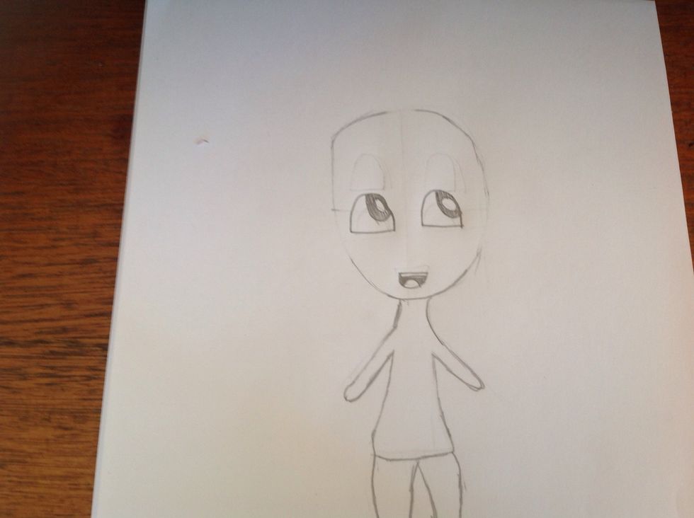 Now shade in the eyes. And once you have done that draw a tough and the top of her lip and shade like so,